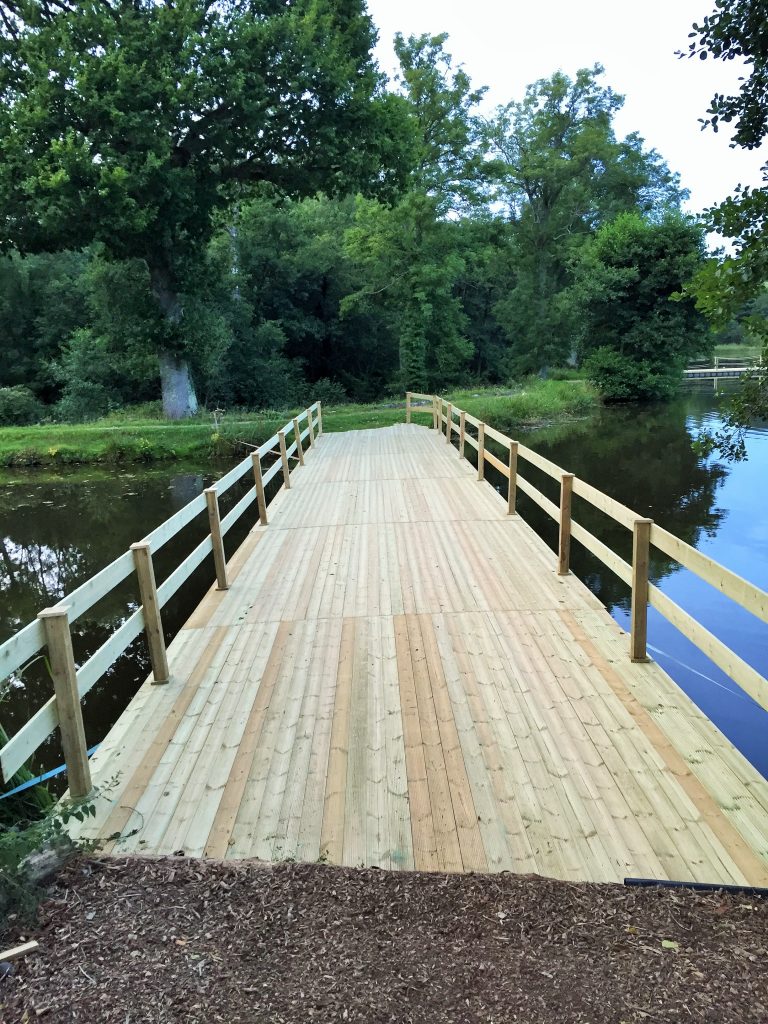 Timber clad pontoon bridge