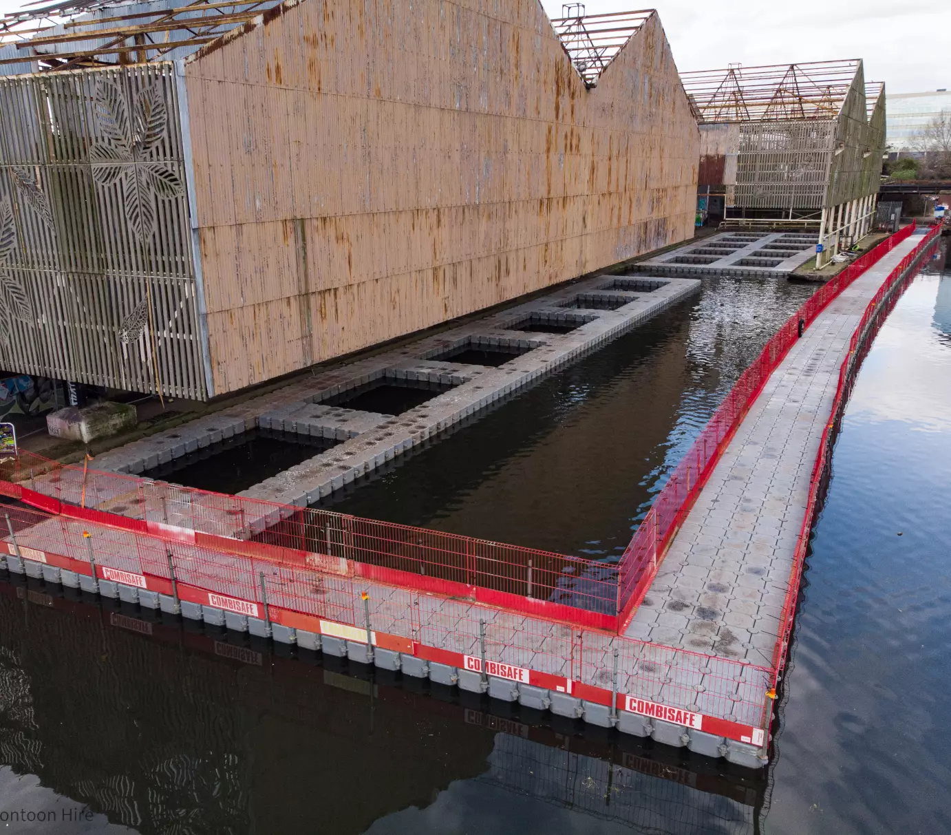 Modular floating pontoon walkway and enclosed working platform providing safe canal-side access for construction and refurbishment works